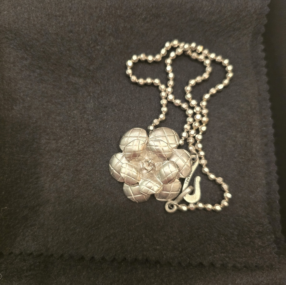 A beautiful brushed silver CHANEL Camillia necklace!
